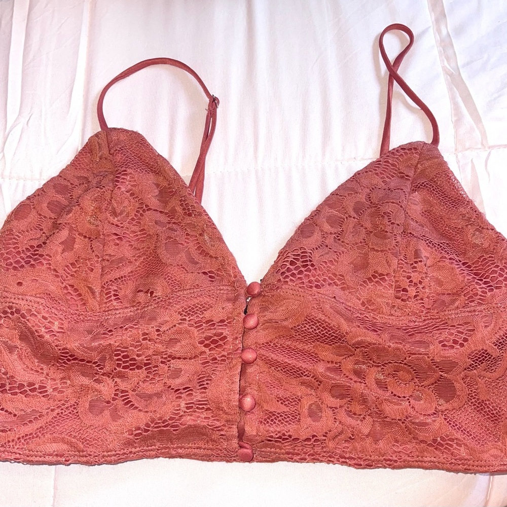 cute top laced with buttons down the middle